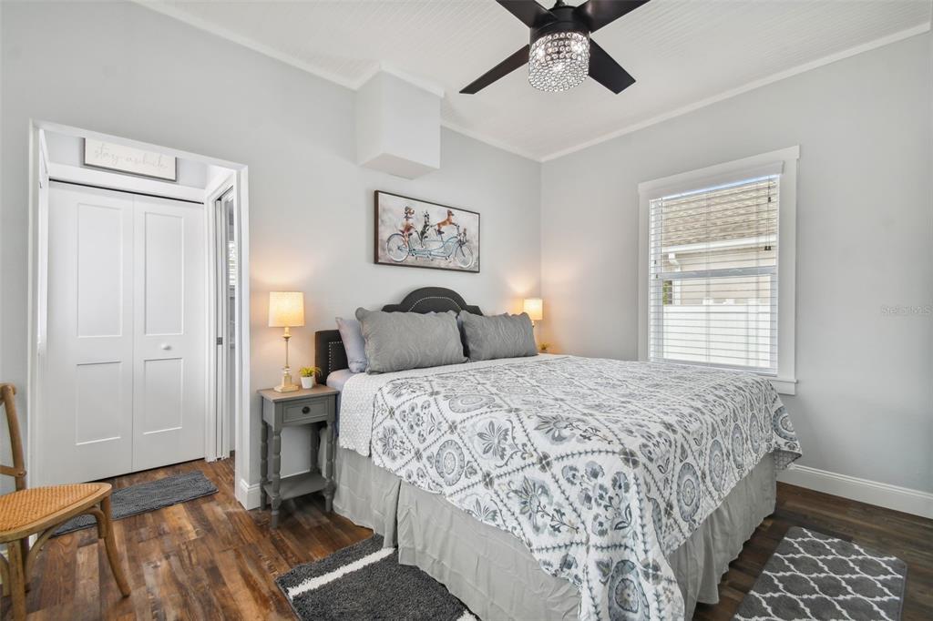 602 Skinner Boulevard Dunedin, FL 34698 - Photo 17 of 27 a bedroom with a bed and wooden floor