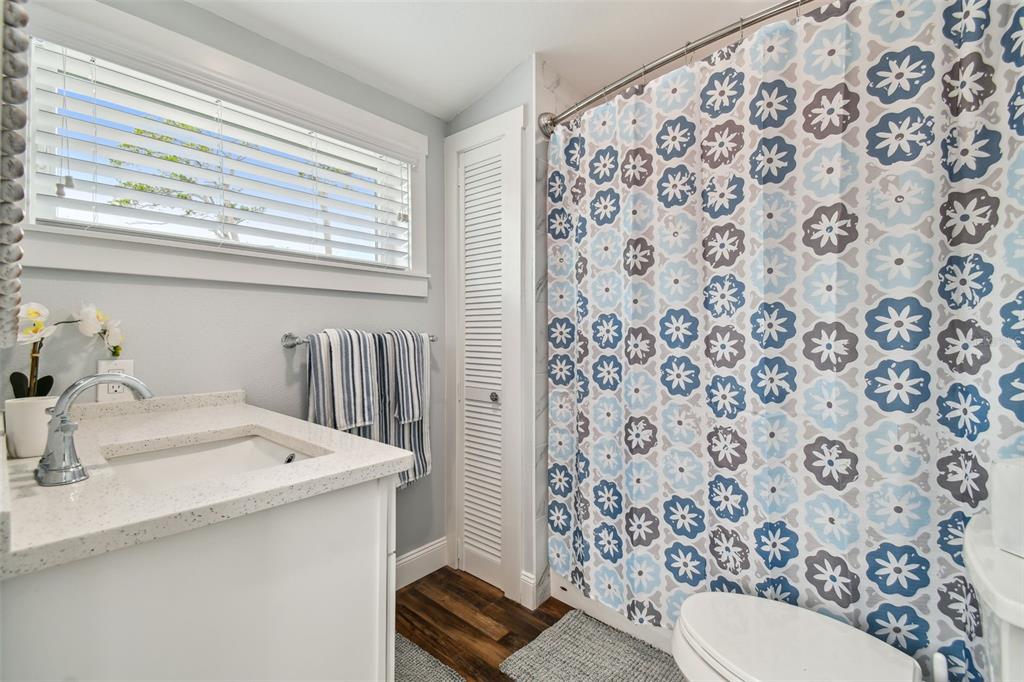 602 Skinner Boulevard Dunedin, FL 34698 - Photo 18 of 27 a bathroom with a sink toilet and shower