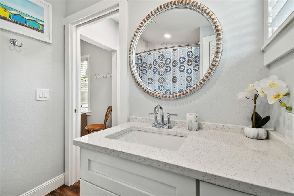 602 Skinner Boulevard Dunedin, FL 34698 - Photo 21 of 27 a bathroom with a sink and a mirror