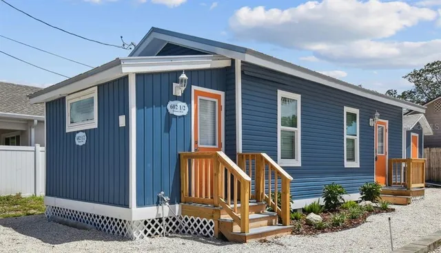 a front view of a house with garage