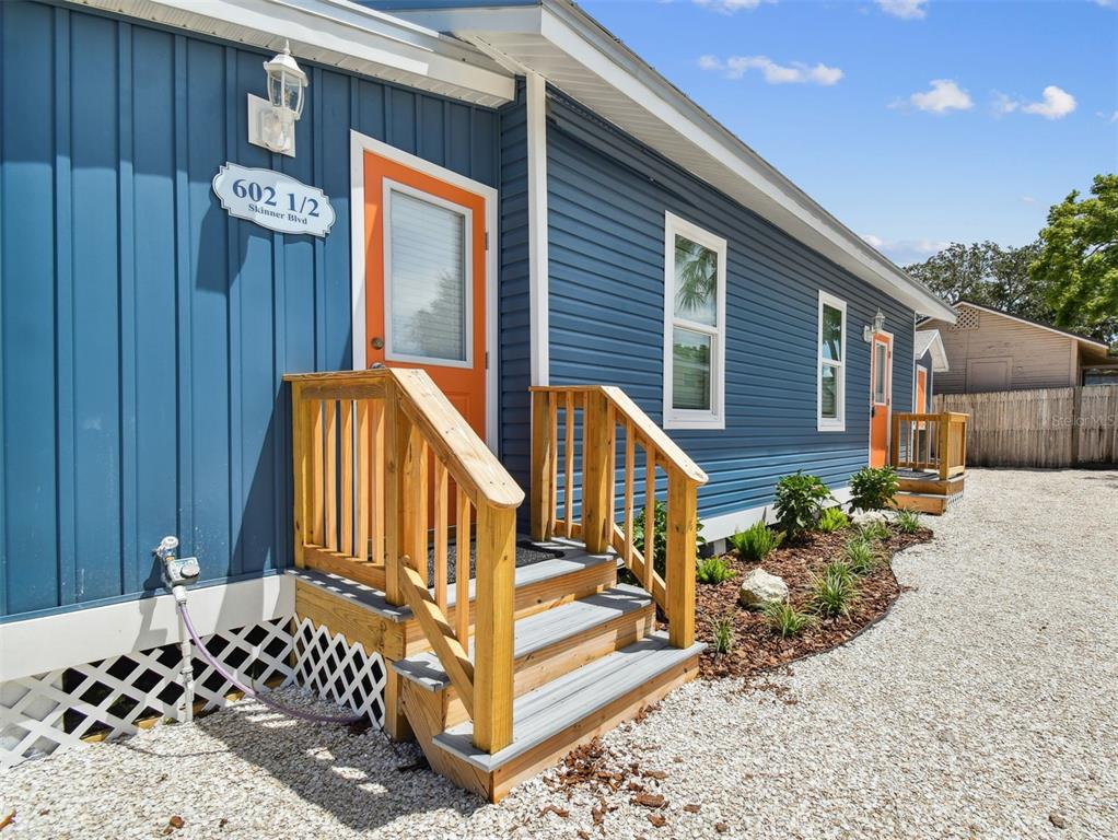 602 Skinner Boulevard Dunedin, FL 34698 - Photo 25 of 27 a view of a house with wooden fence