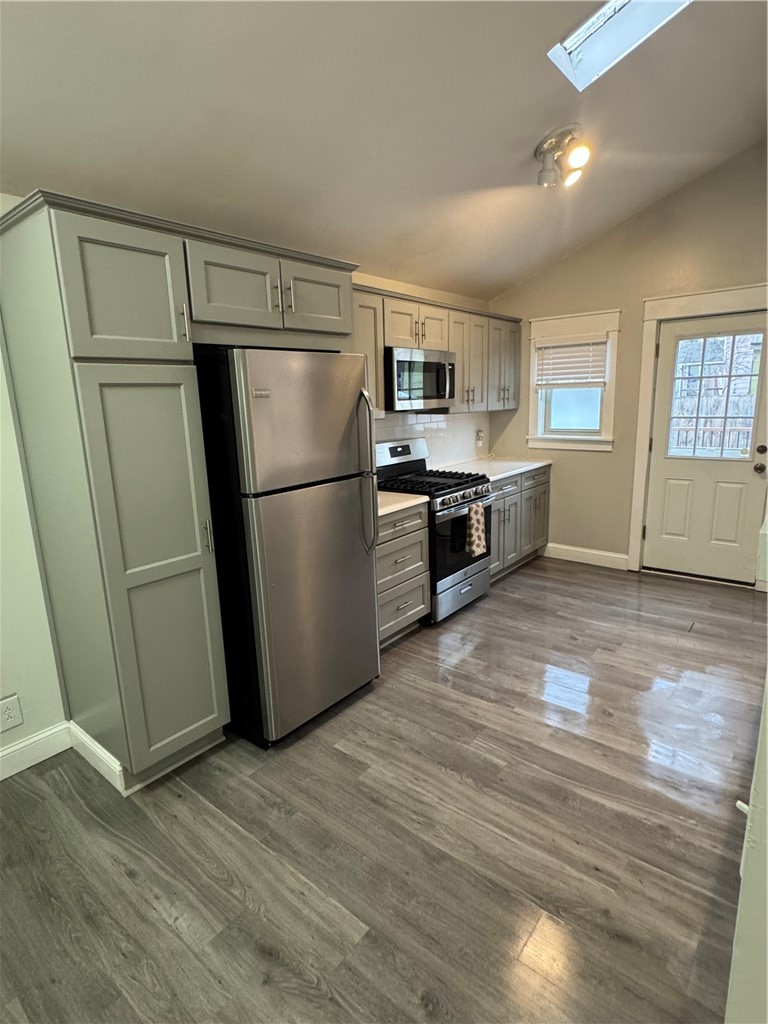 216 South Plain Street Ithaca, NY 14850 - Photo 6 of 47 Vaulted ceiling in kitchen and skylight