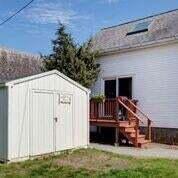 6 Wallace Avenue Buzzards Bay, MA 02532 - Photo 20 of 31 a view of a house with a yard