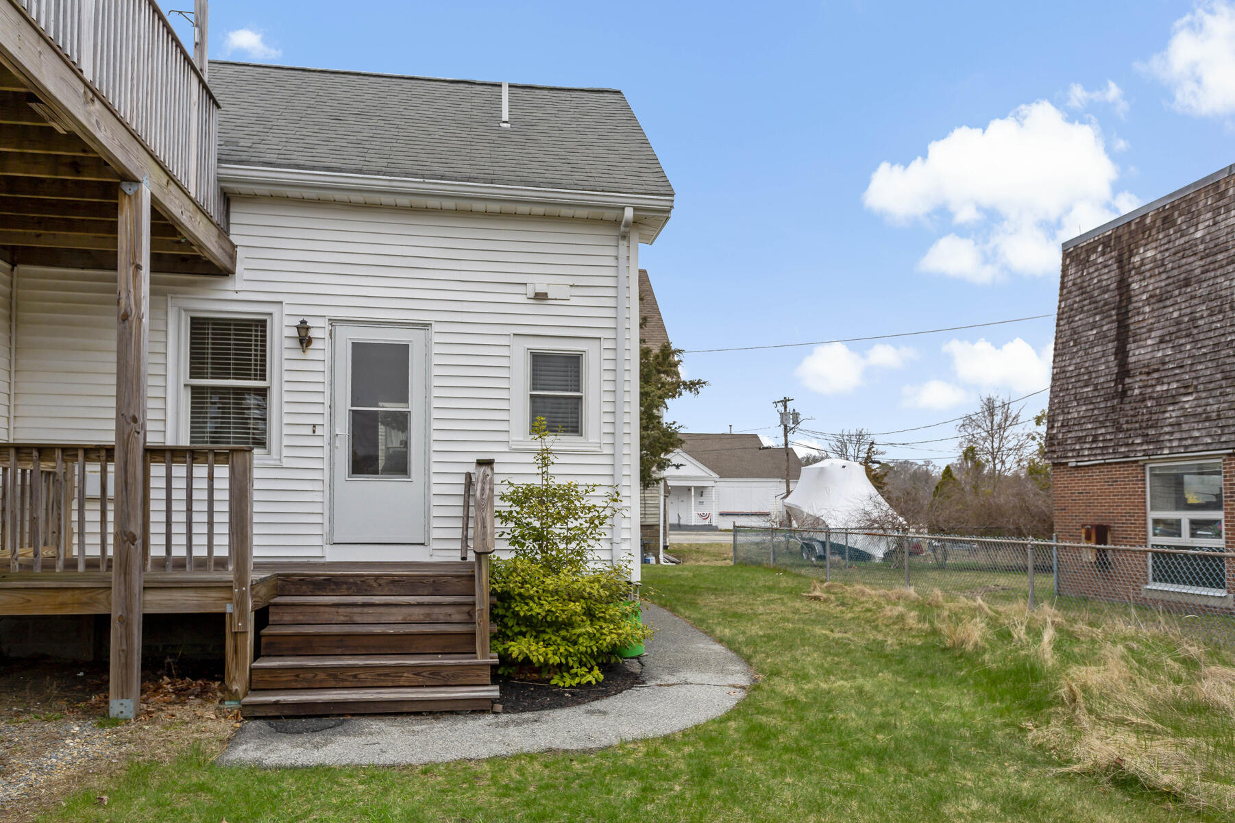 6 Wallace Avenue Buzzards Bay, MA 02532 - Photo 28 of 31 a view of a house with a yard