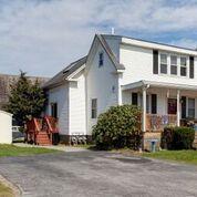 6 Wallace Avenue Buzzards Bay, MA 02532 - Photo 3 of 31 a front view of a house with garden