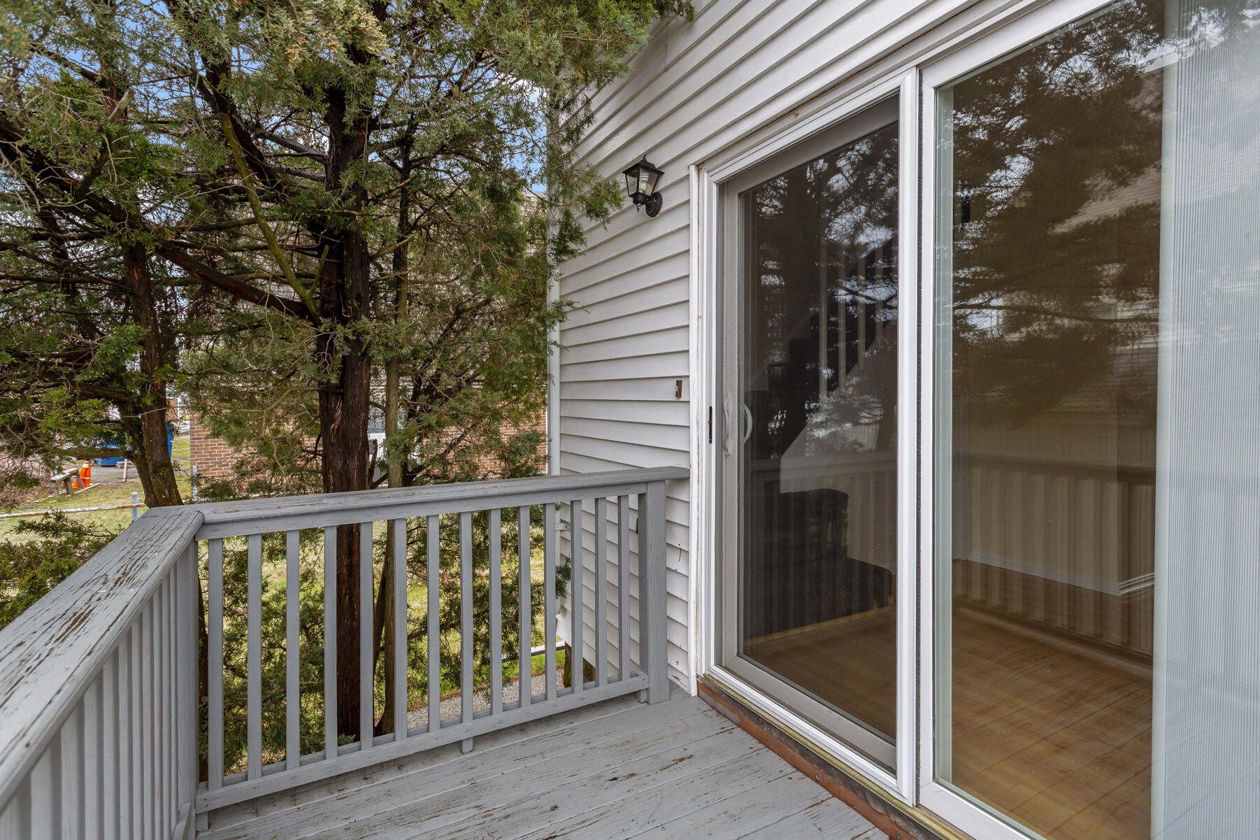 6 Wallace Avenue Buzzards Bay, MA 02532 - Photo 4 of 31 a view of balcony with floor to ceiling window and wooden fence