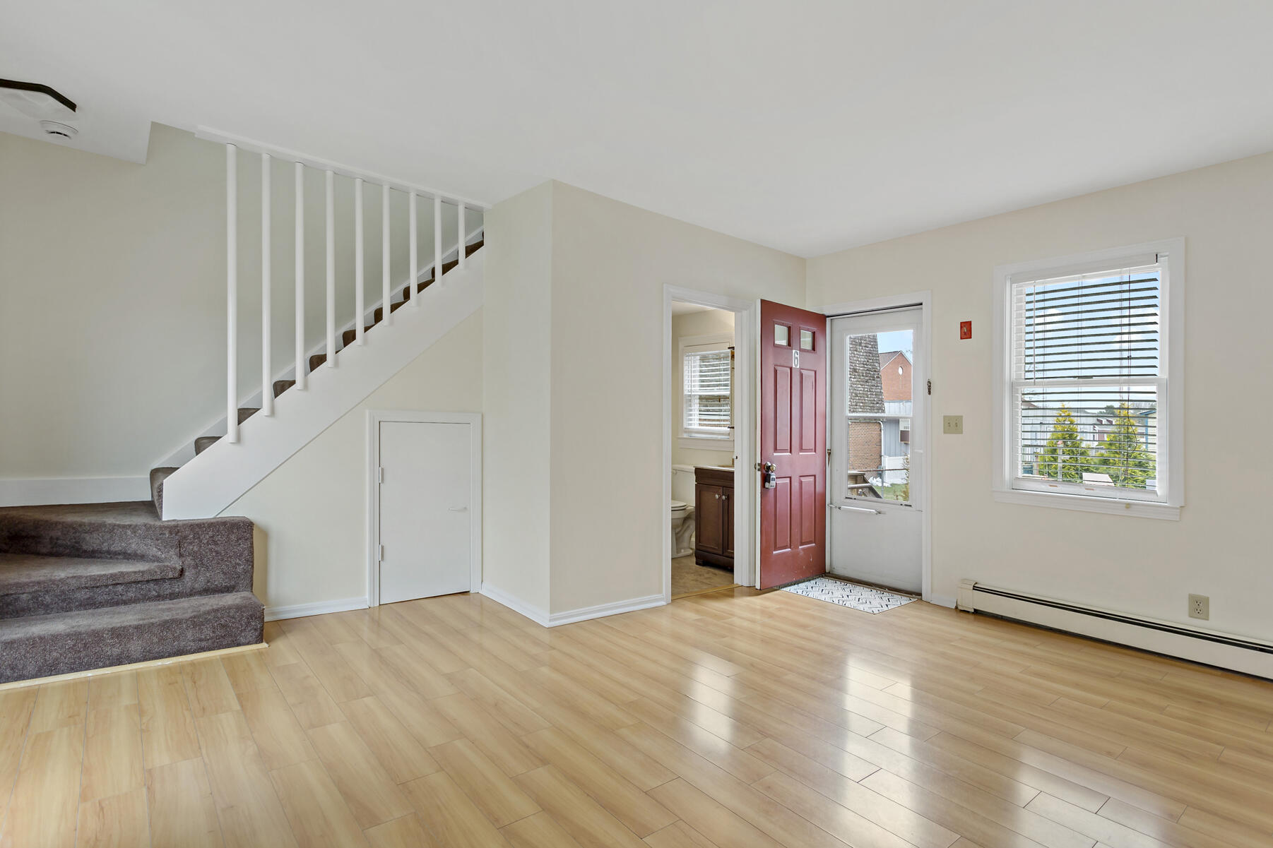6 Wallace Avenue Buzzards Bay, MA 02532 - Photo 5 of 31 a view of an empty room with wooden floor and stairs