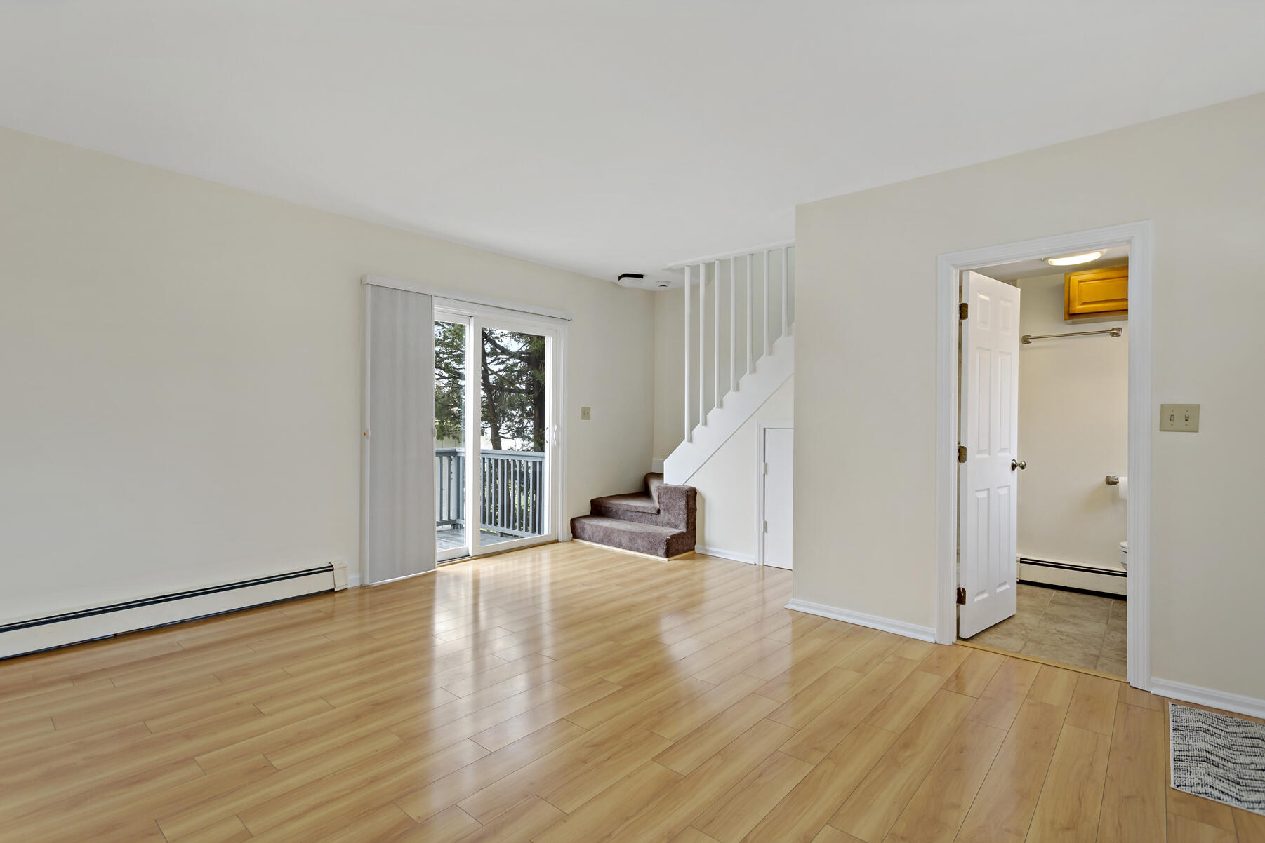6 Wallace Avenue Buzzards Bay, MA 02532 - Photo 6 of 31 an empty room with wooden floor and a window