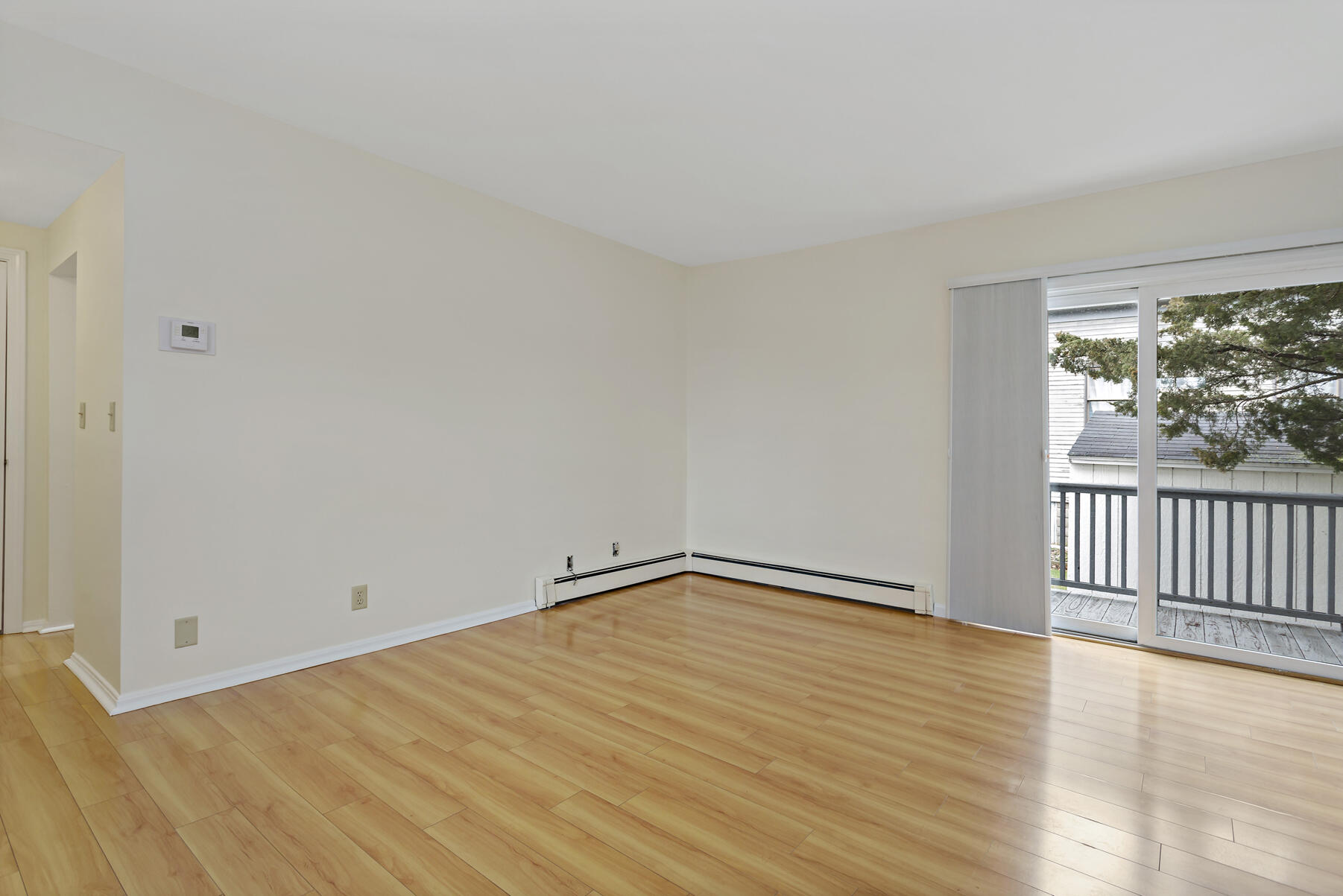 6 Wallace Avenue Buzzards Bay, MA 02532 - Photo 8 of 31 a view of an empty room with wooden floor and a window