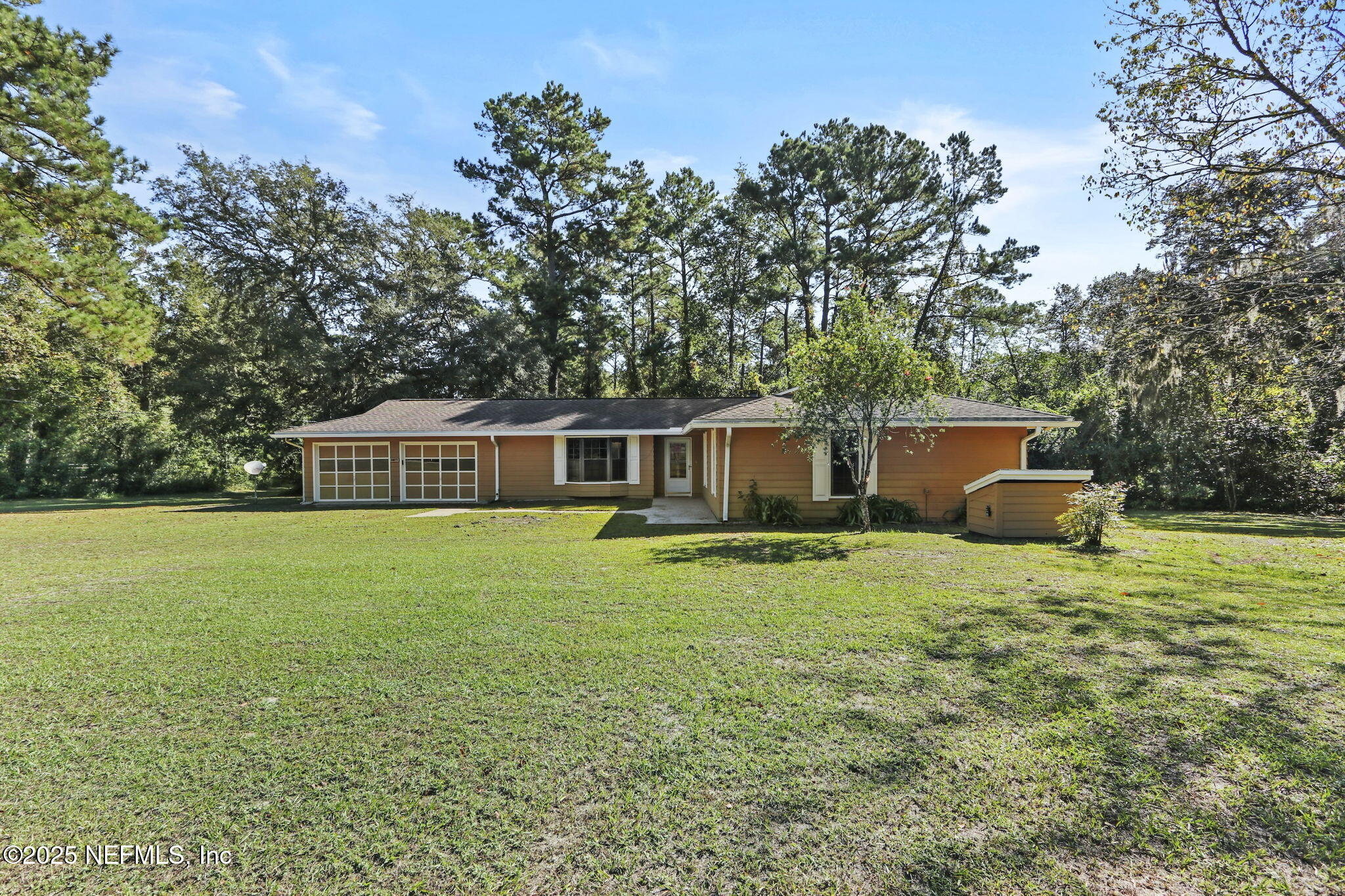 1733 Hereford Road Middleburg, FL 32068 - Photo 14 of 44 a front view of a house with garden