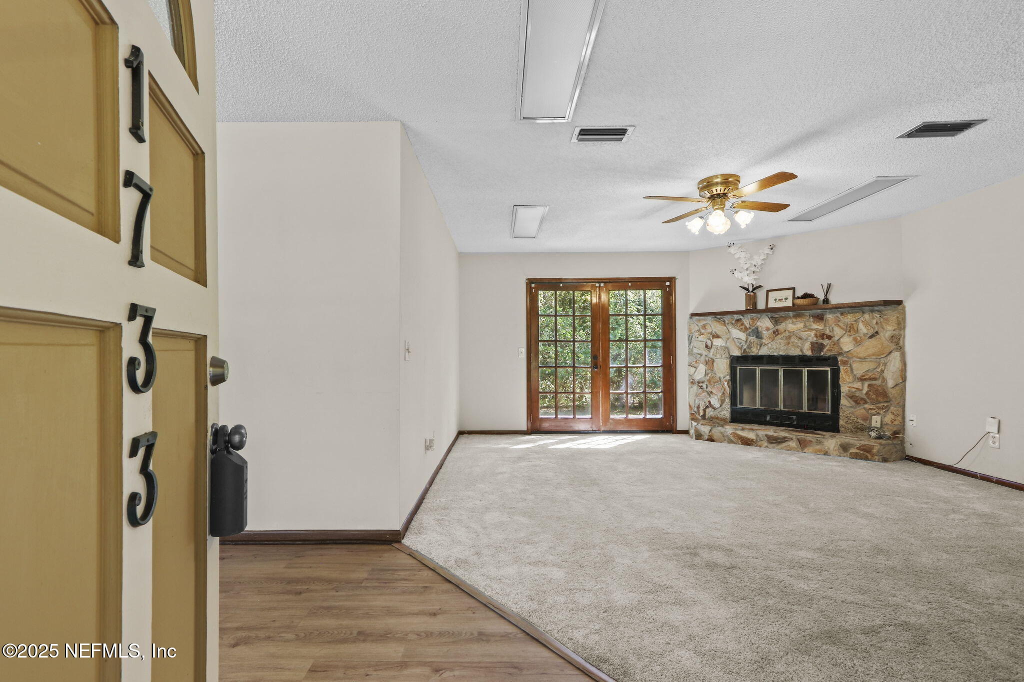 1733 Hereford Road Middleburg, FL 32068 - Photo 20 of 44 a big room with chandelier fan and windows
