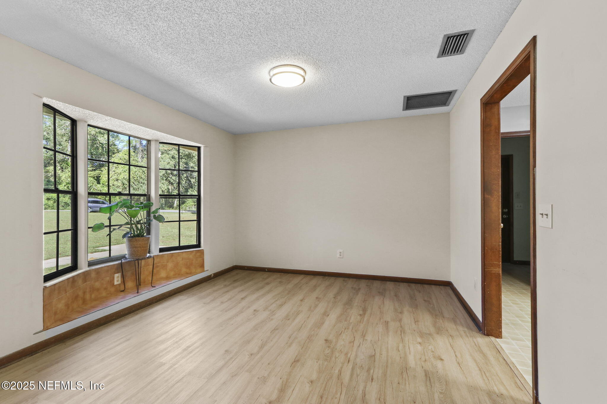 1733 Hereford Road Middleburg, FL 32068 - Photo 21 of 44 a view of room with window and wooden floor