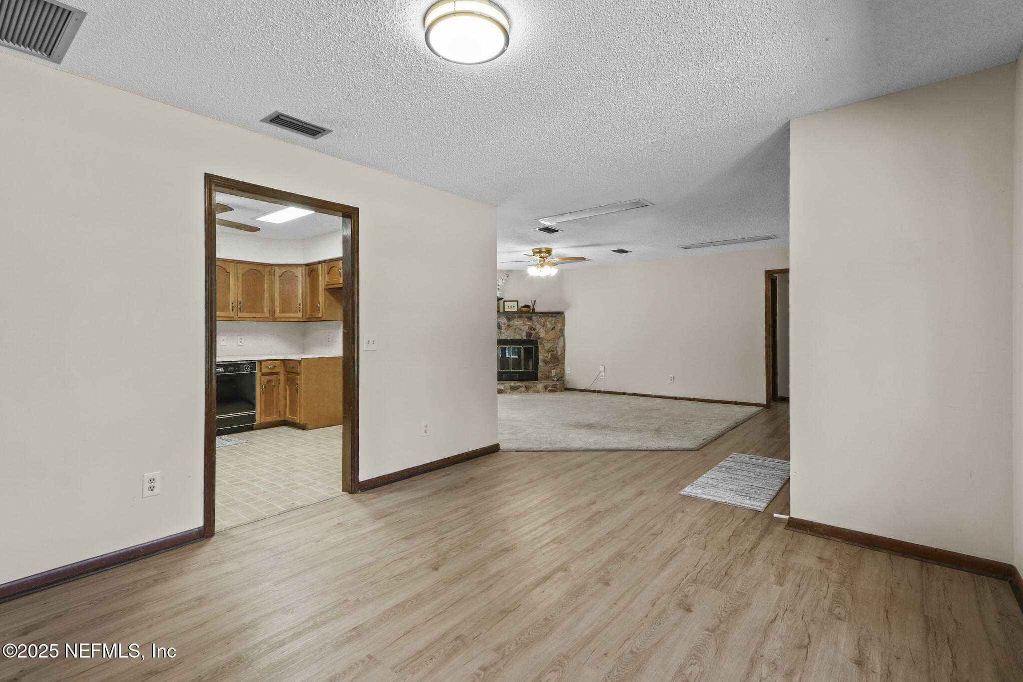 1733 Hereford Road Middleburg, FL 32068 - Photo 22 of 44 an empty room with wooden floor and a window