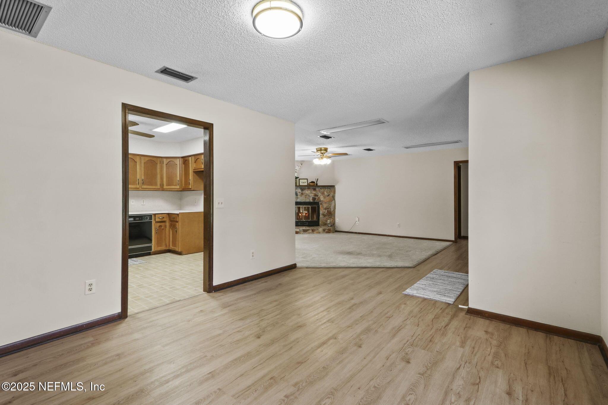 1733 Hereford Road Middleburg, FL 32068 - Photo 23 of 44 an empty room with wooden floor and a window