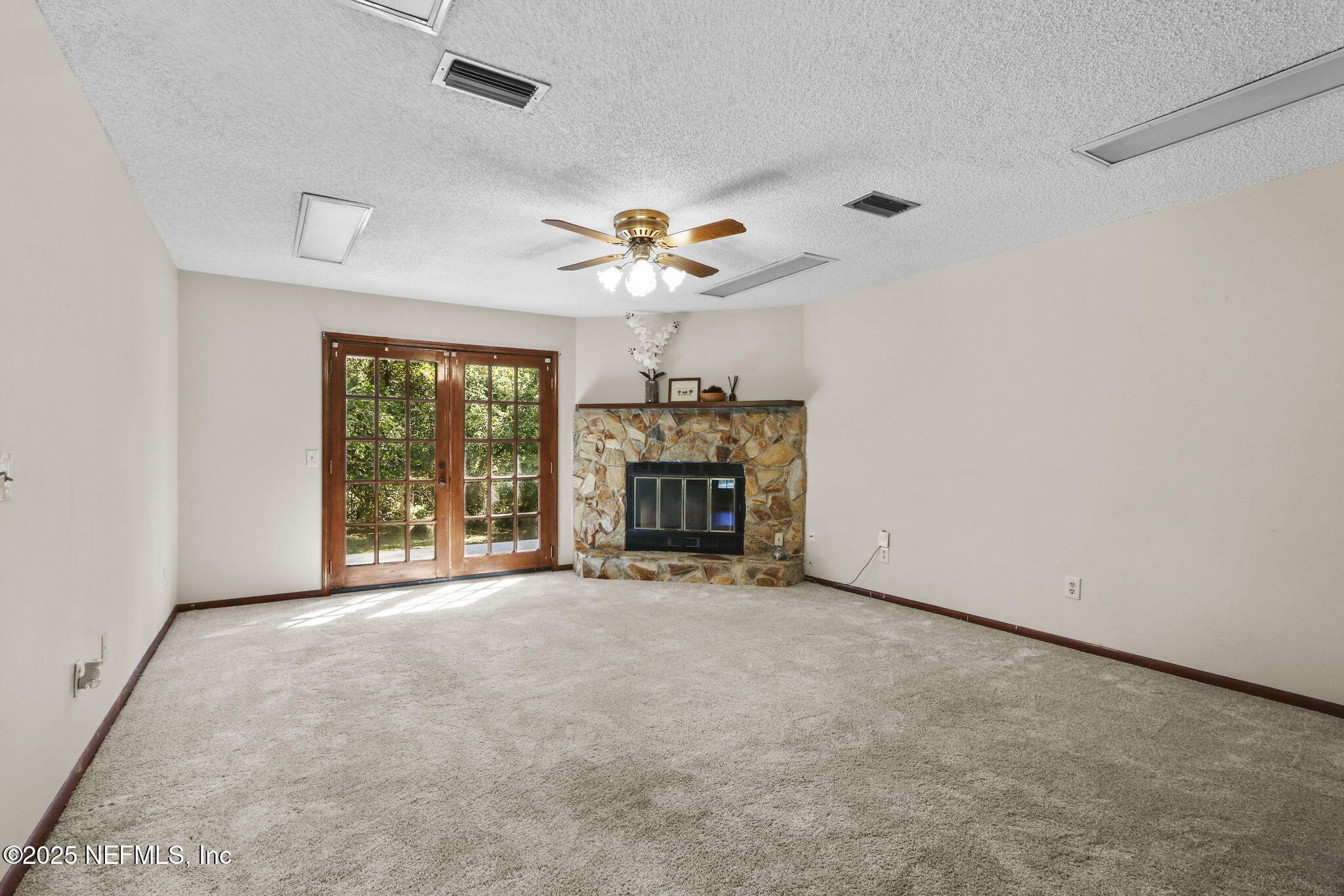 1733 Hereford Road Middleburg, FL 32068 - Photo 24 of 44 an empty room with windows and fireplace