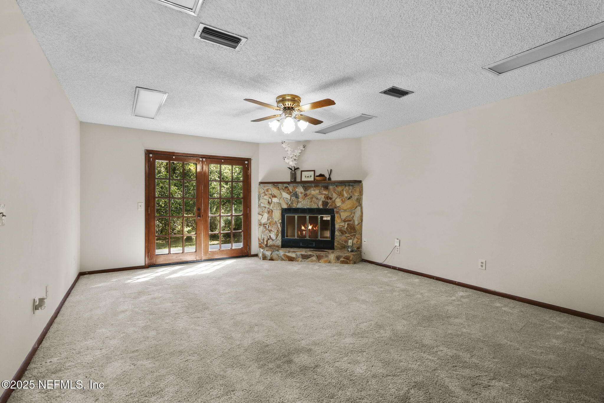 1733 Hereford Road Middleburg, FL 32068 - Photo 25 of 44 an empty room with windows and fireplace