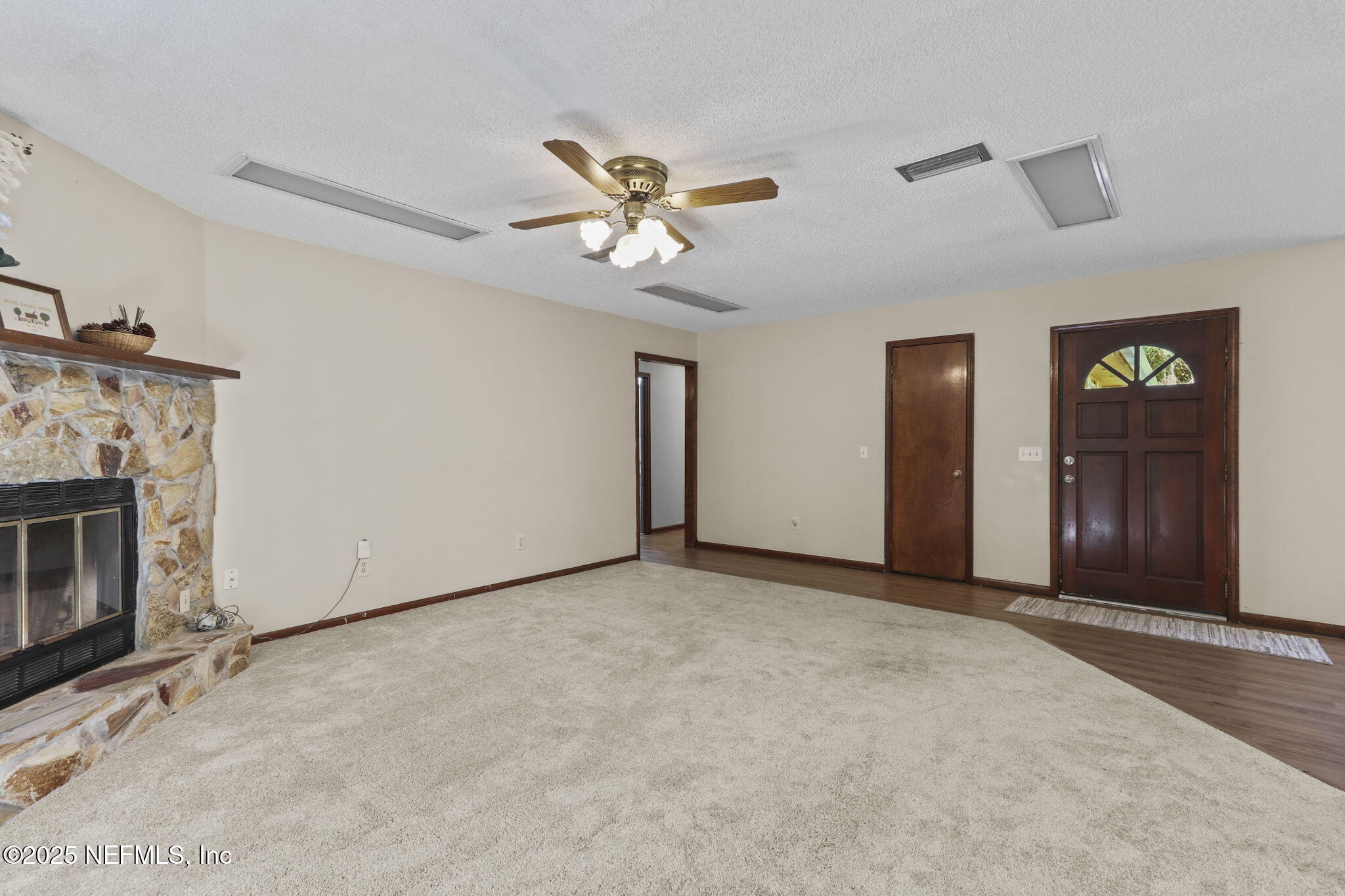 1733 Hereford Road Middleburg, FL 32068 - Photo 26 of 44 a view of an empty room with closet and a fireplace