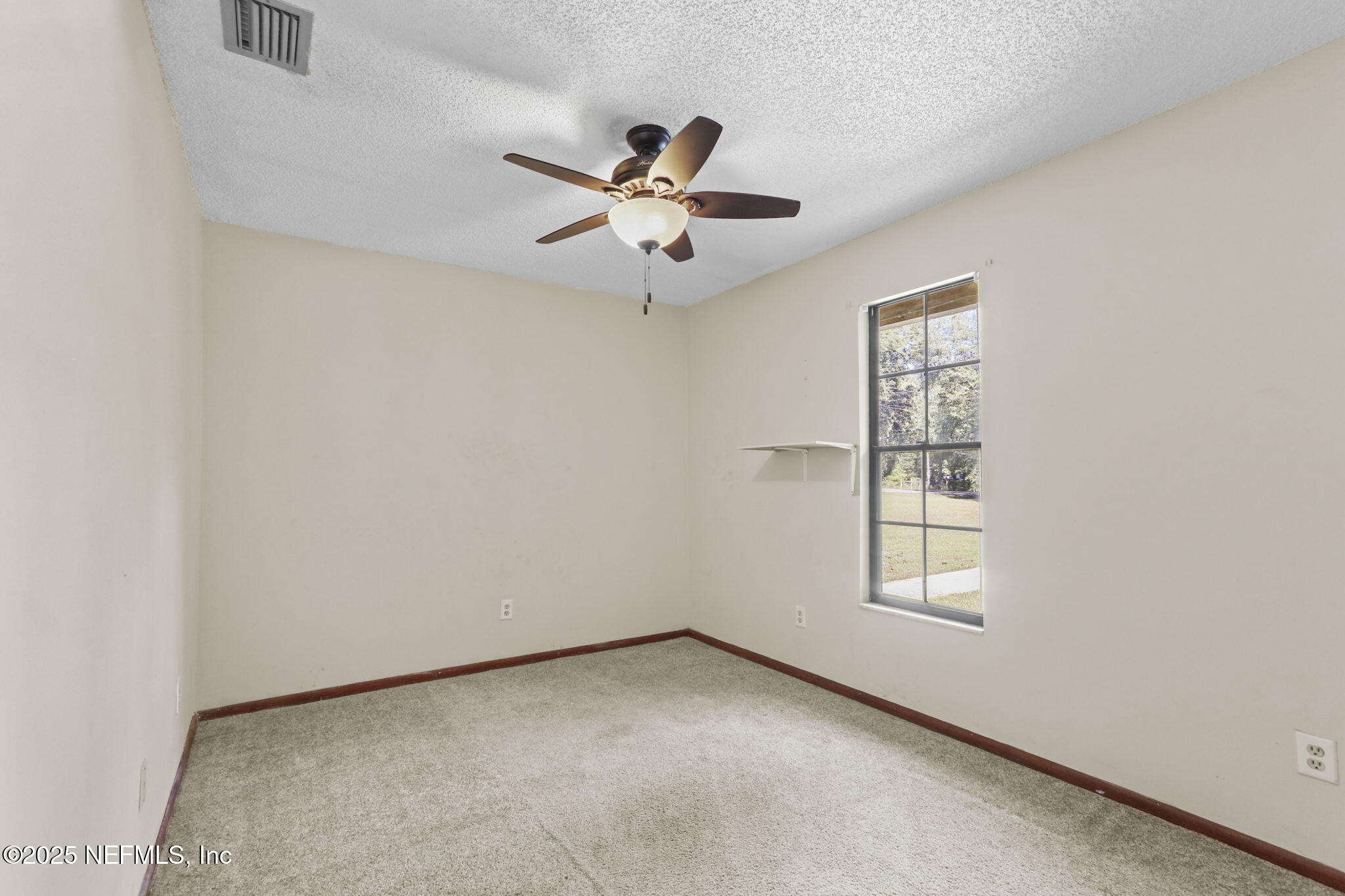 1733 Hereford Road Middleburg, FL 32068 - Photo 34 of 44 an empty room with windows and fan
