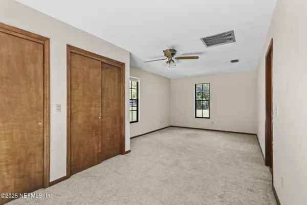a view of a livingroom with a ceiling fan