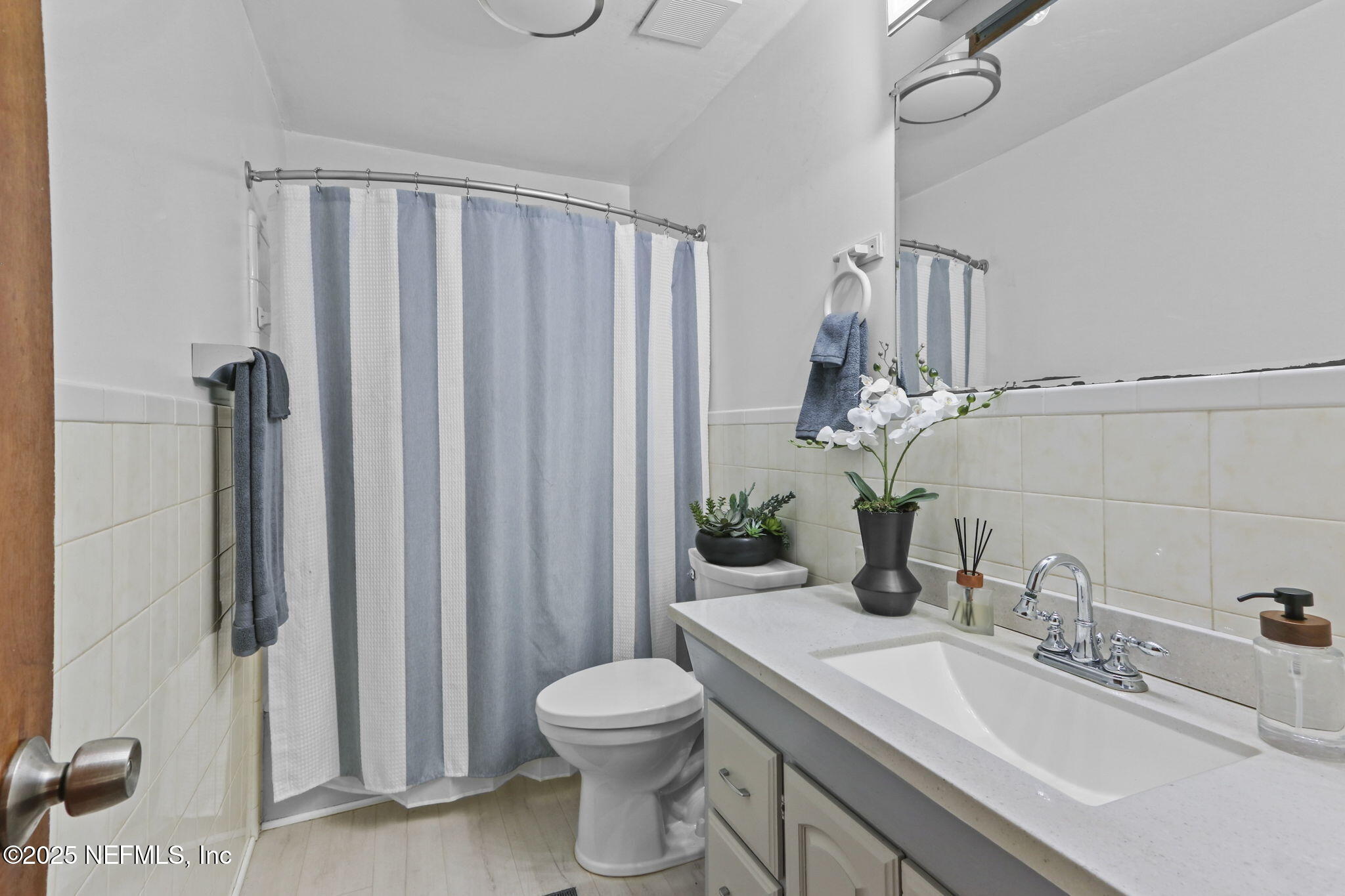 1733 Hereford Road Middleburg, FL 32068 - Photo 4 of 44 a bathroom with a granite countertop sink toilet and shower
