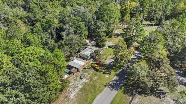 a view of a house with a tree