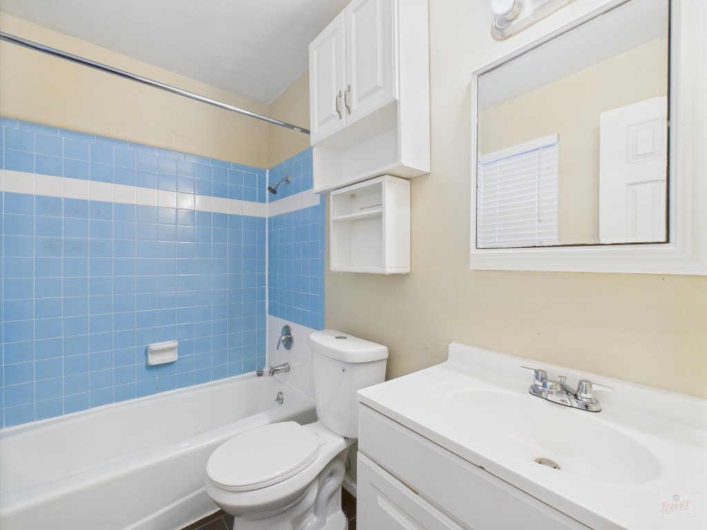 1106 West 22nd Street, Unit 5 Austin, TX 78705 - Photo 11 of 15 a bathroom with a sink a toilet and shower