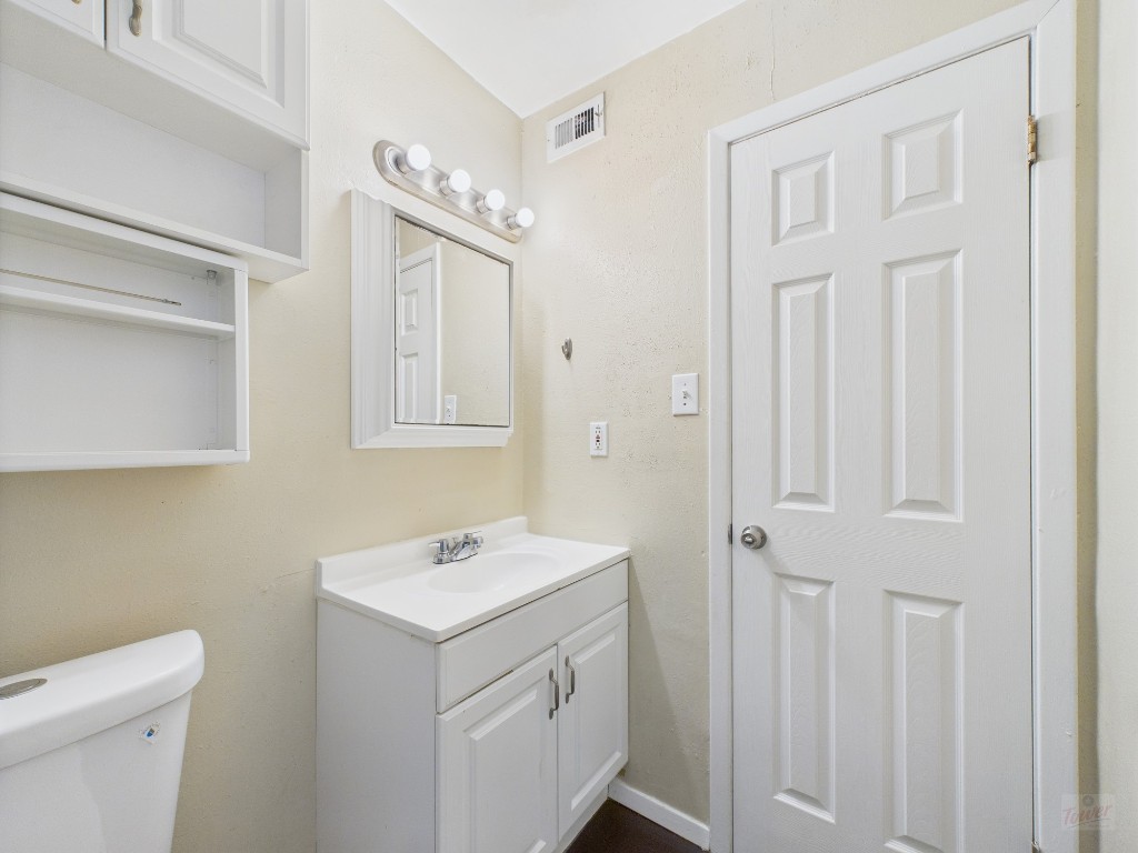 1106 West 22nd Street, Unit 5 Austin, TX 78705 - Photo 12 of 15 a bathroom with a sink a toilet and shower