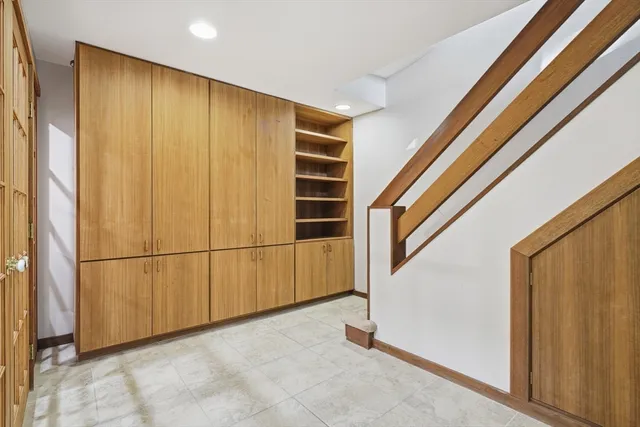 a view of an empty room with a door