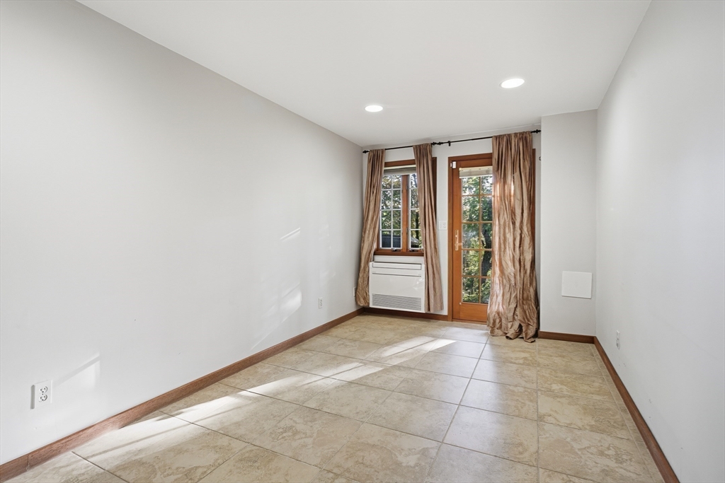 184 Rawson Road Brookline, MA 02445 - Photo 16 of 29 a view of an empty room with a window