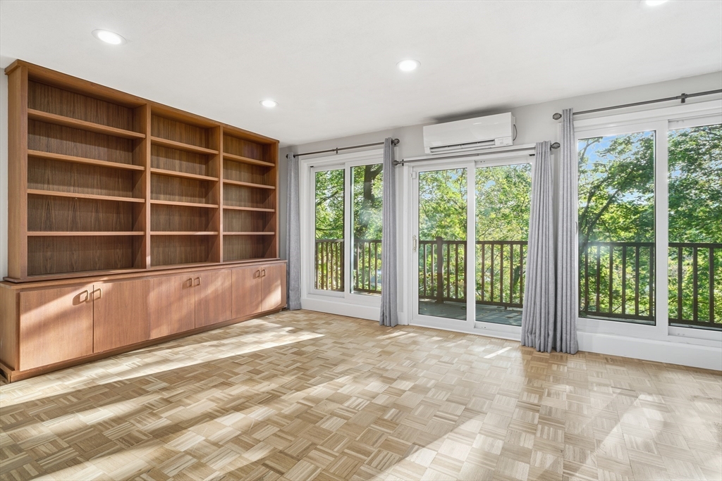 184 Rawson Road Brookline, MA 02445 - Photo 3 of 29 a view of an empty room with a window and balcony