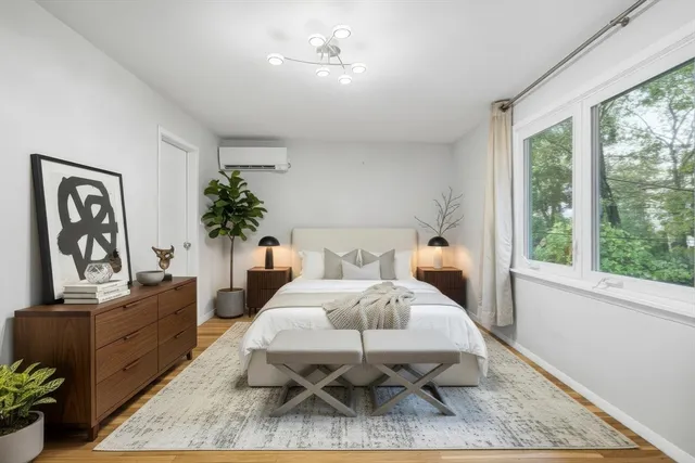 a bed room with furniture and wooden floor