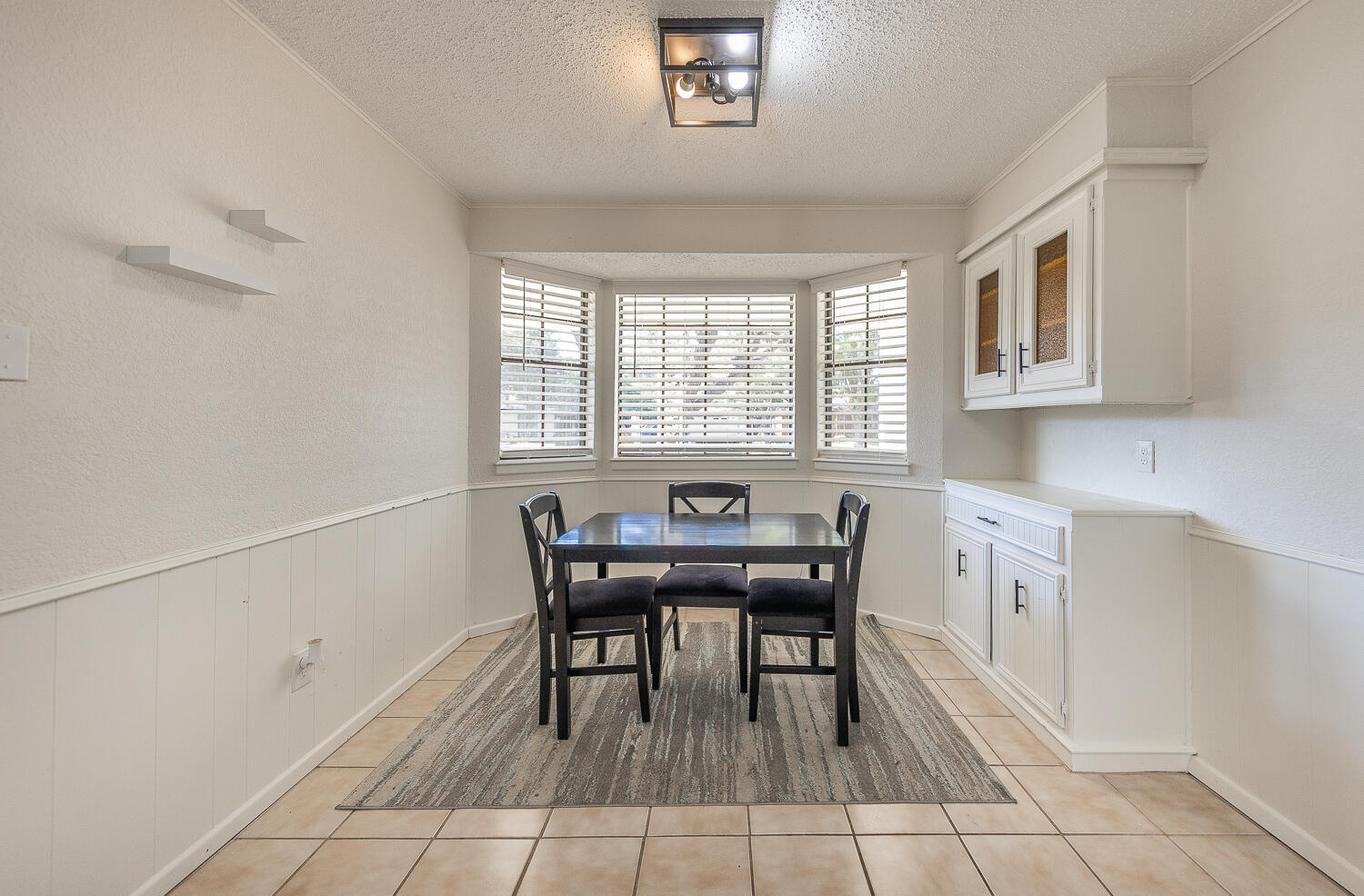 4706 78th Street Lubbock, TX 79424 - Photo 14 of 43 a view of a dining room with furniture and window