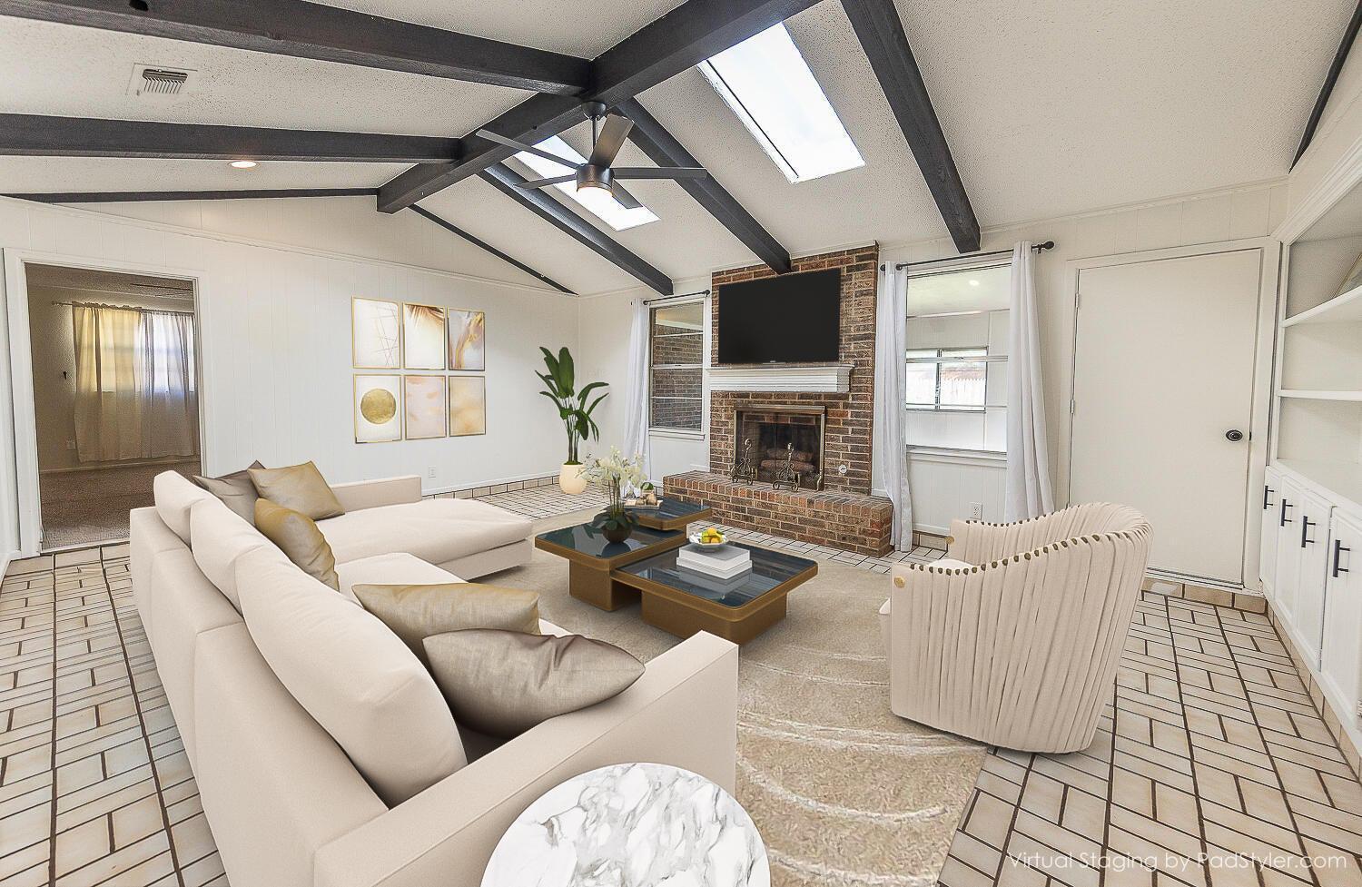 4706 78th Street Lubbock, TX 79424 - Photo 2 of 43 a living room with furniture fireplace and a flat screen tv