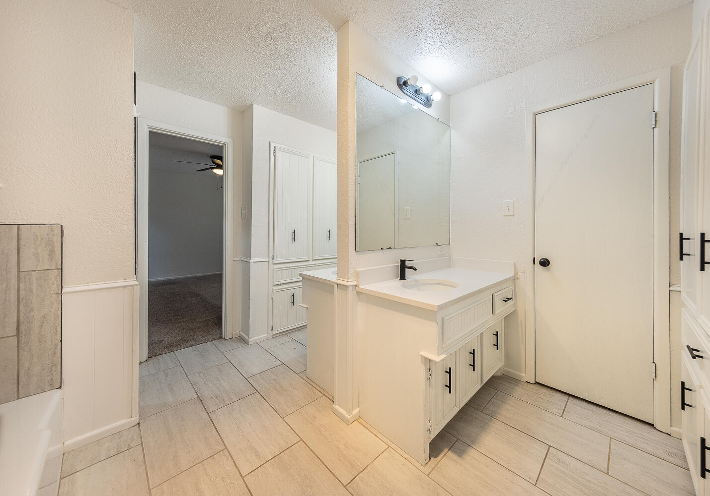 4706 78th Street Lubbock, TX 79424 - Photo 21 of 43 a view of utility room with closet and windows