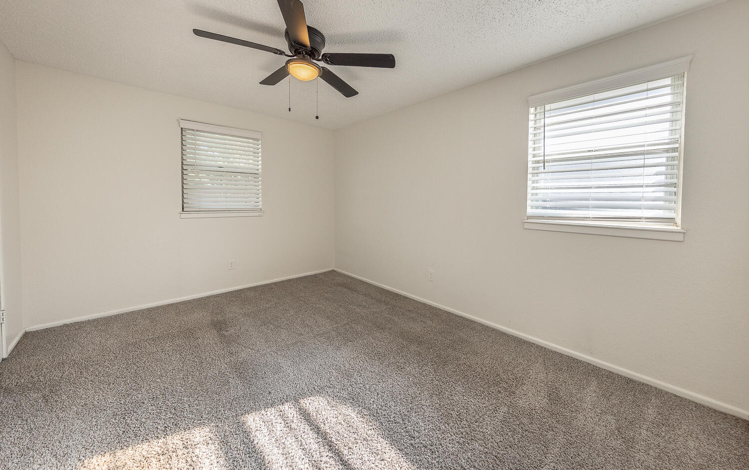 4706 78th Street Lubbock, TX 79424 - Photo 23 of 43 a view of an empty room with a window