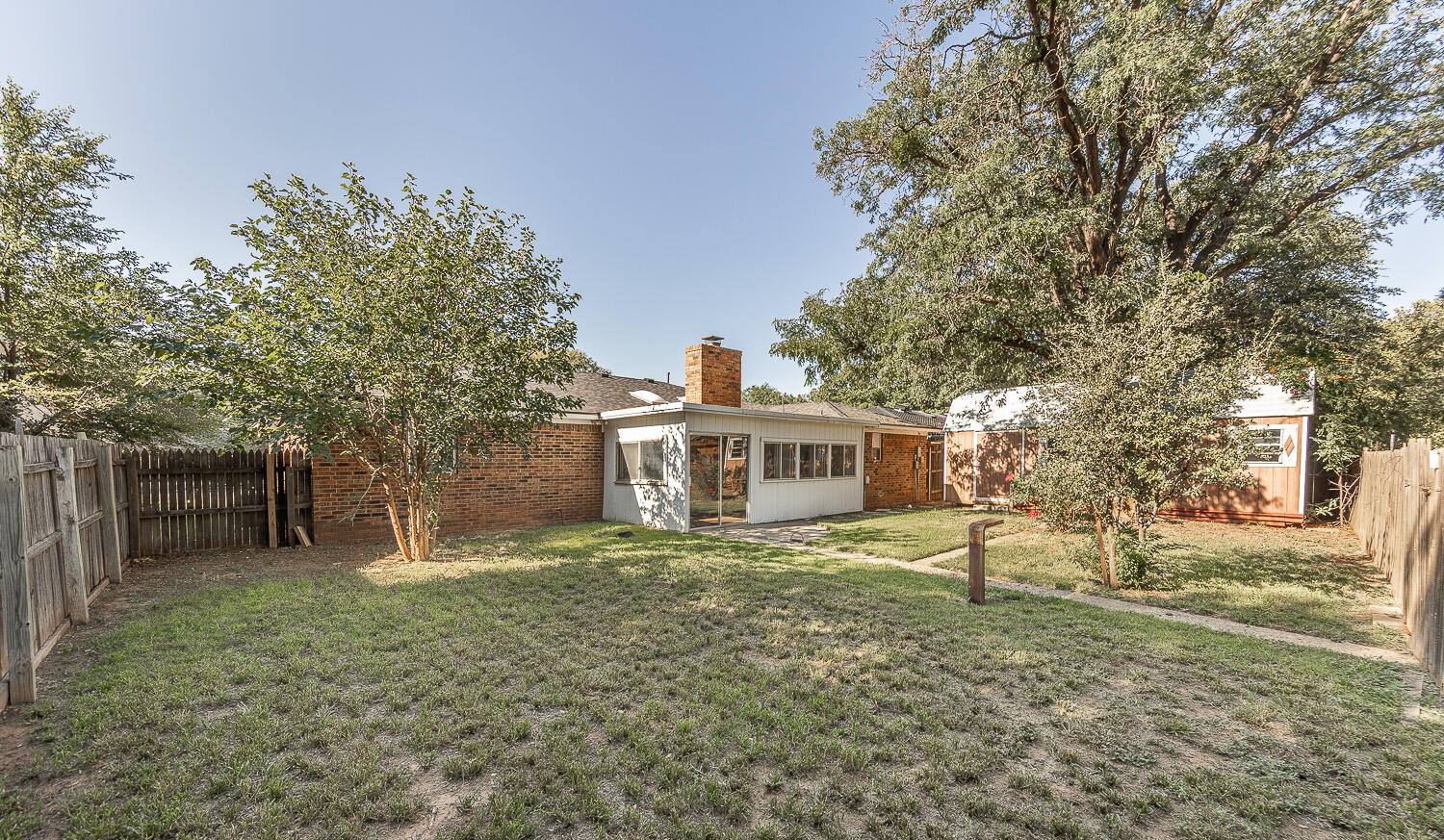 4706 78th Street Lubbock, TX 79424 - Photo 32 of 43 a view of a house with a yard