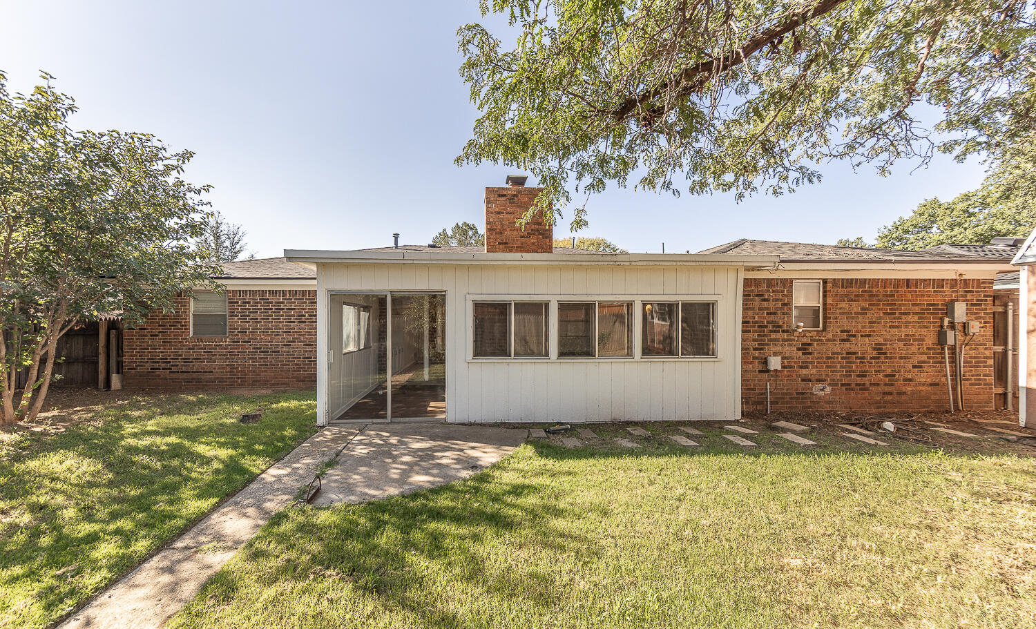 4706 78th Street Lubbock, TX 79424 - Photo 33 of 43 a house with trees in the background