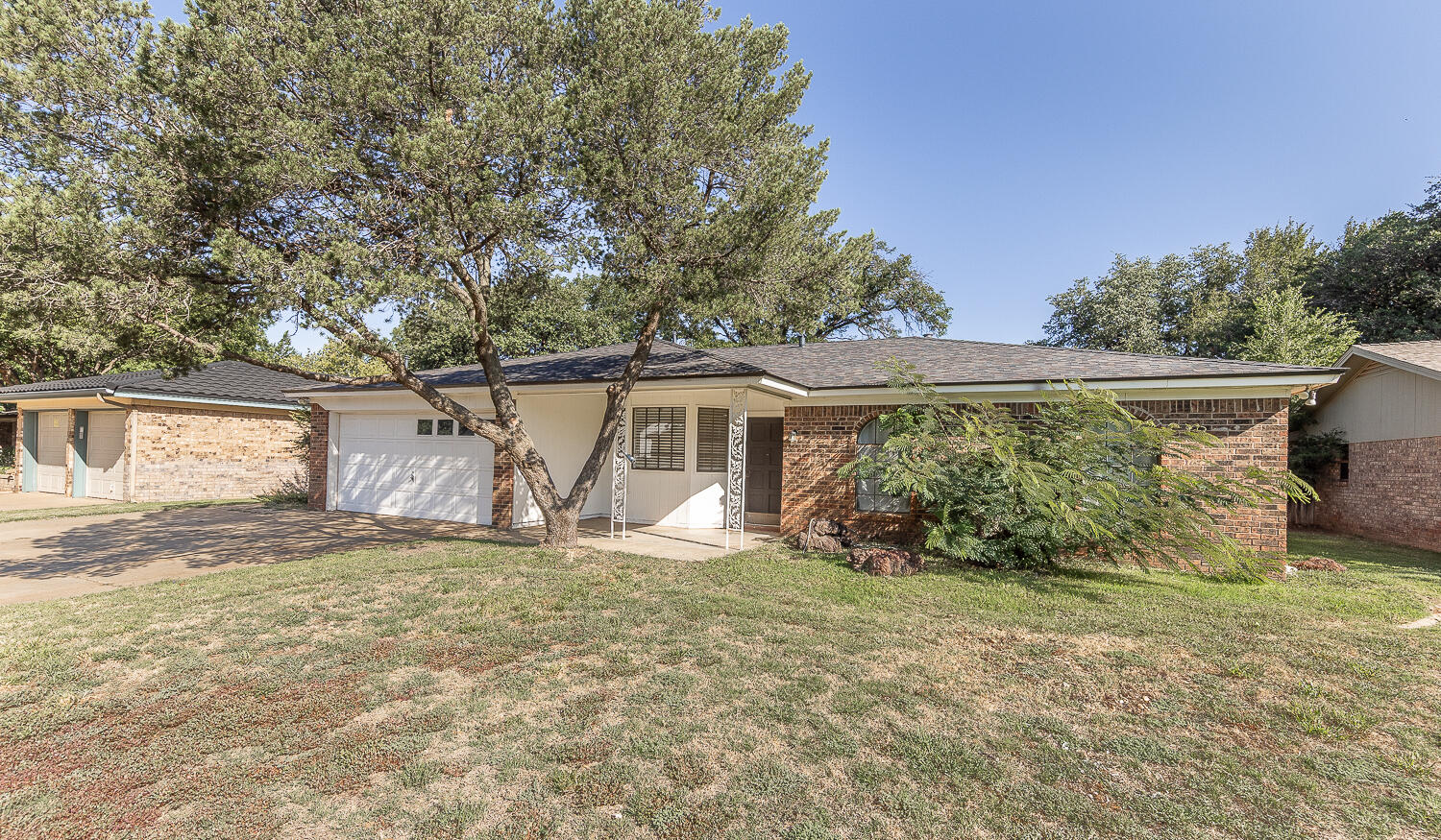 4706 78th Street Lubbock, TX 79424 - Photo 35 of 43 a view of a house with a yard