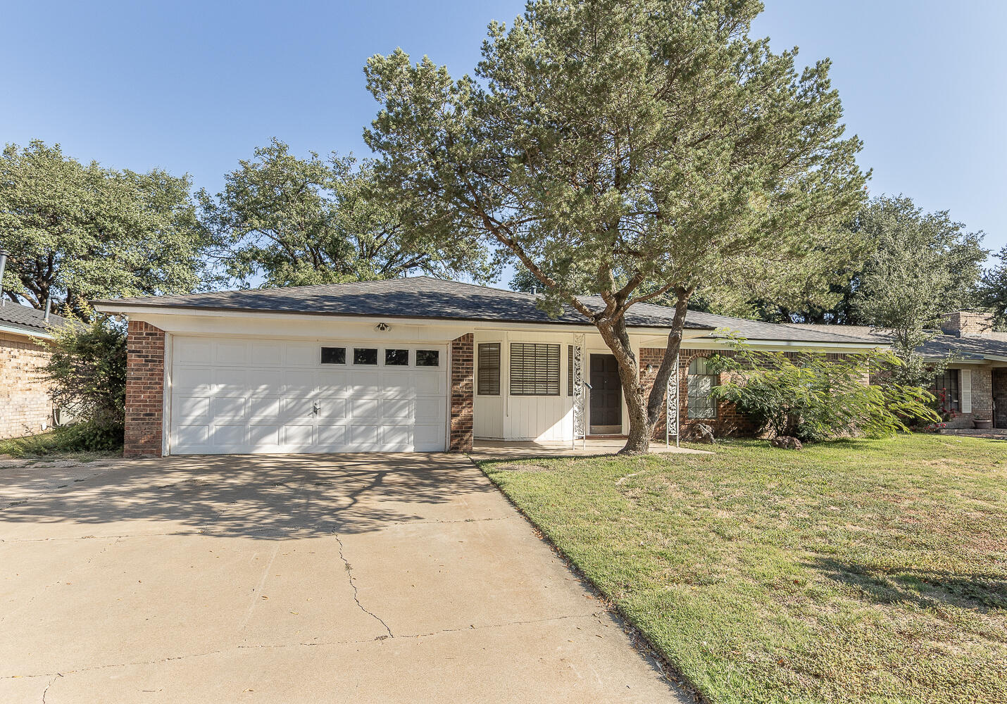 4706 78th Street Lubbock, TX 79424 - Photo 36 of 43 a front view of a house with a yard