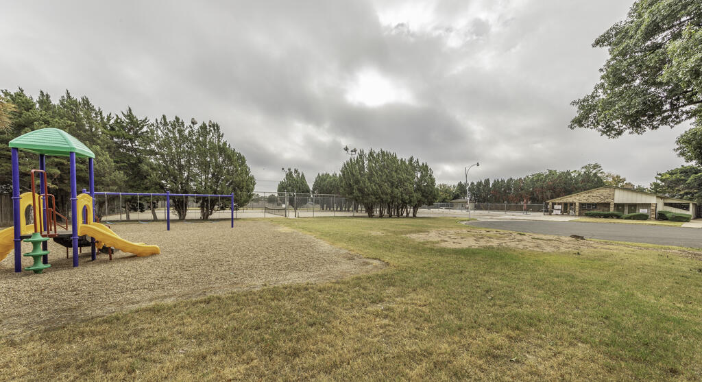 4706 78th Street Lubbock, TX 79424 - Photo 37 of 43 a view of a swimming pool with an outdoor seating and a yard
