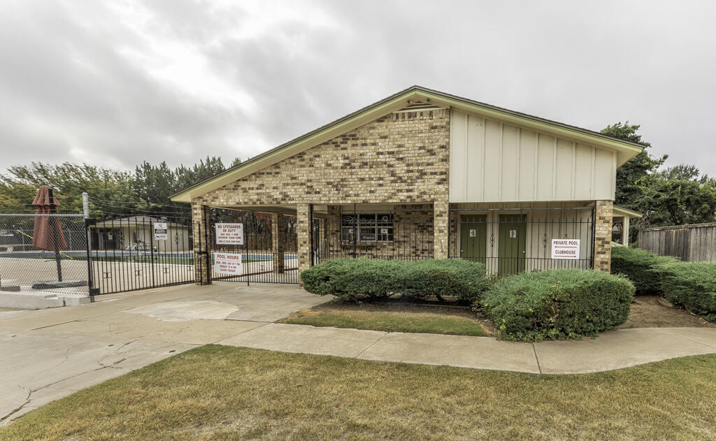 4706 78th Street Lubbock, TX 79424 - Photo 40 of 43 a front view of a house with a garden