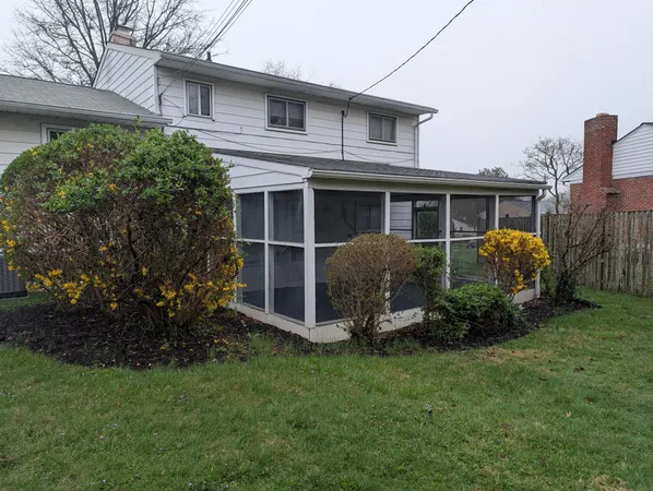 a view of a house with backyard porch and garden