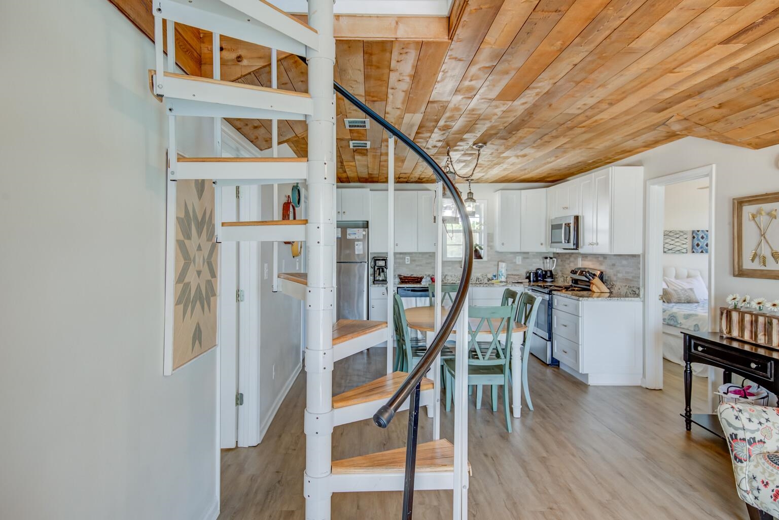 564 Our Road Gulf Shores, AL 36542 - Photo 9 of 44 Spiral stairs to addition
