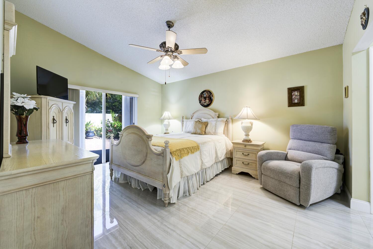 151 St Michaels Court Jupiter, FL 33458 - Photo 19 of 41 a bedroom with bed and a flat screen tv