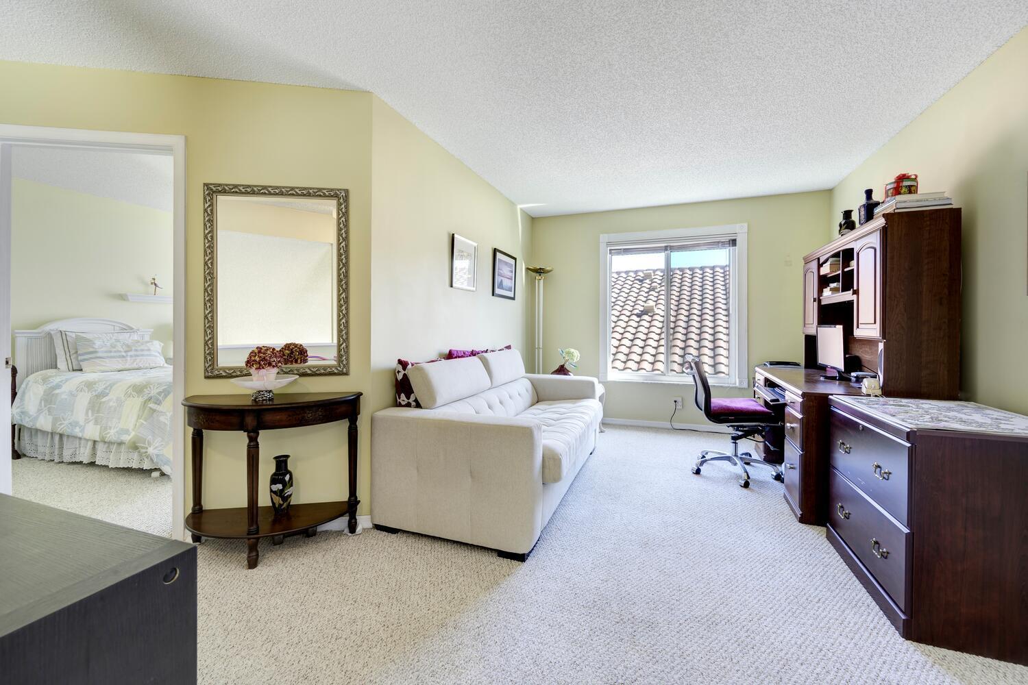 151 St Michaels Court Jupiter, FL 33458 - Photo 22 of 41 a living room with furniture a flat screen tv and a table