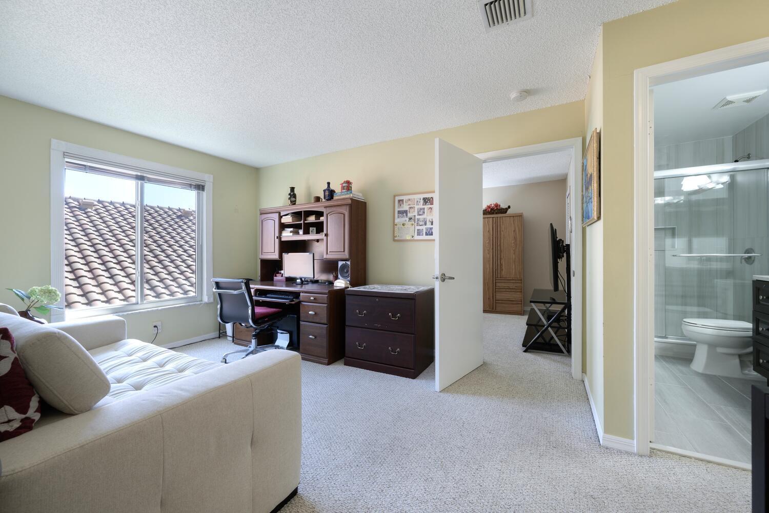 151 St Michaels Court Jupiter, FL 33458 - Photo 32 of 41 a bedroom with a bed and furniture