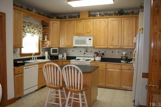 99 Skinner Road Four Oaks, NC 27524 - Photo 7 of 10 Loads of cabinets, pantry, eat-at-island/bar!!