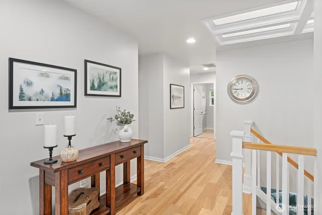 a view of a hallway with wooden floor