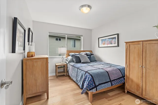 a bedroom with a bed and a cabinets