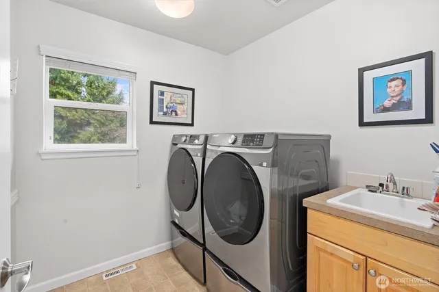 a utility room with dryer and washer